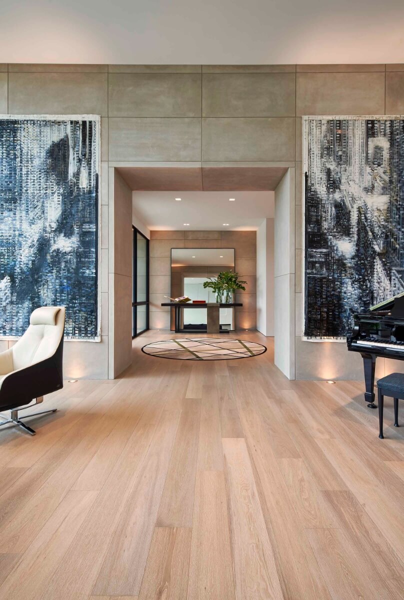 Lounge area with piano and large abstract art pieces