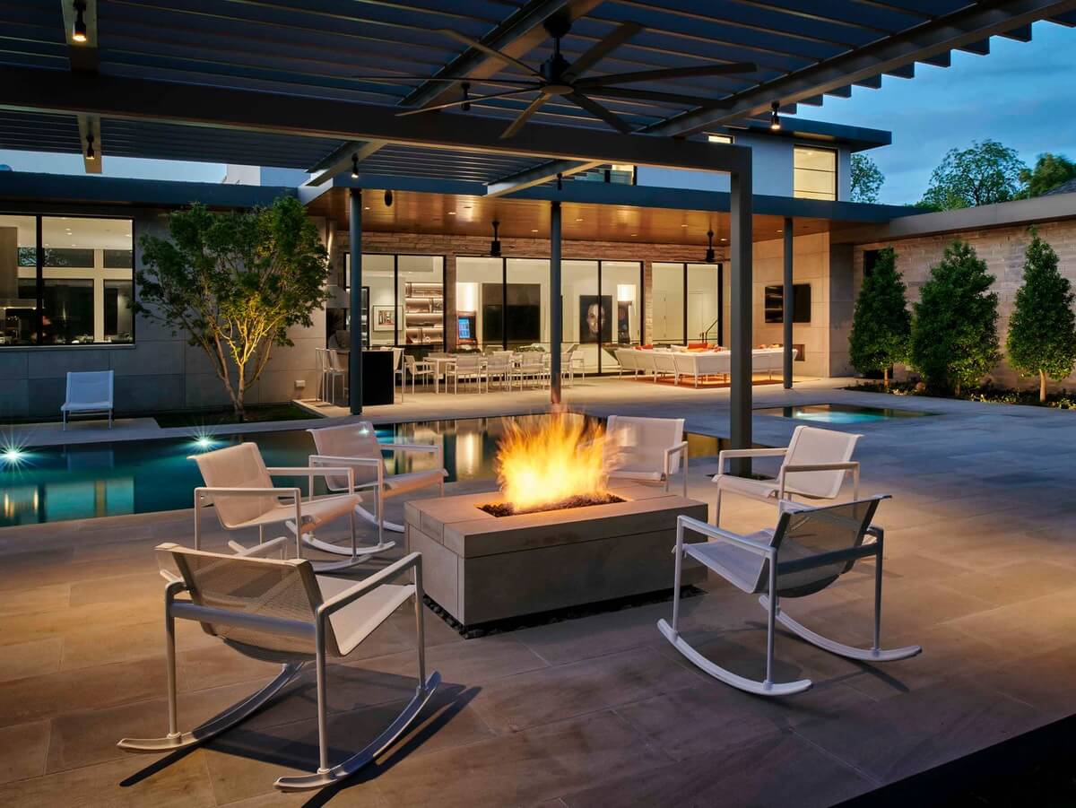 Outdoor seating area by firepit and pool