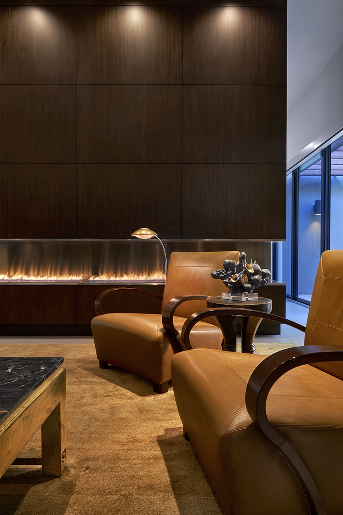 Leather lounge chairs in front of fireplace