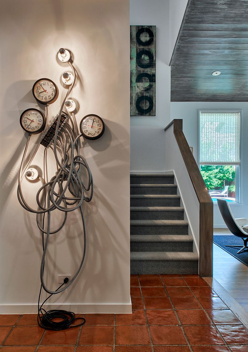 stairwell with art fixture off to the side of it
