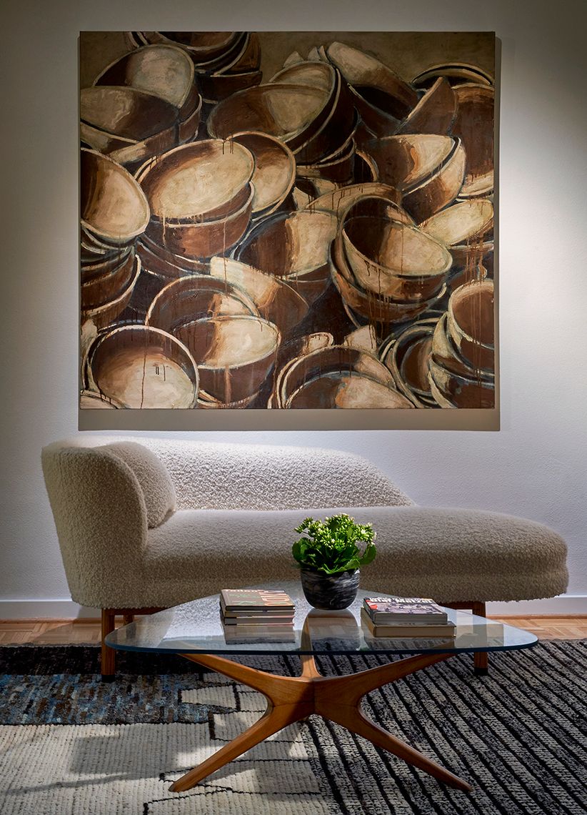 seating area with white chaise lounge with glass coffee table