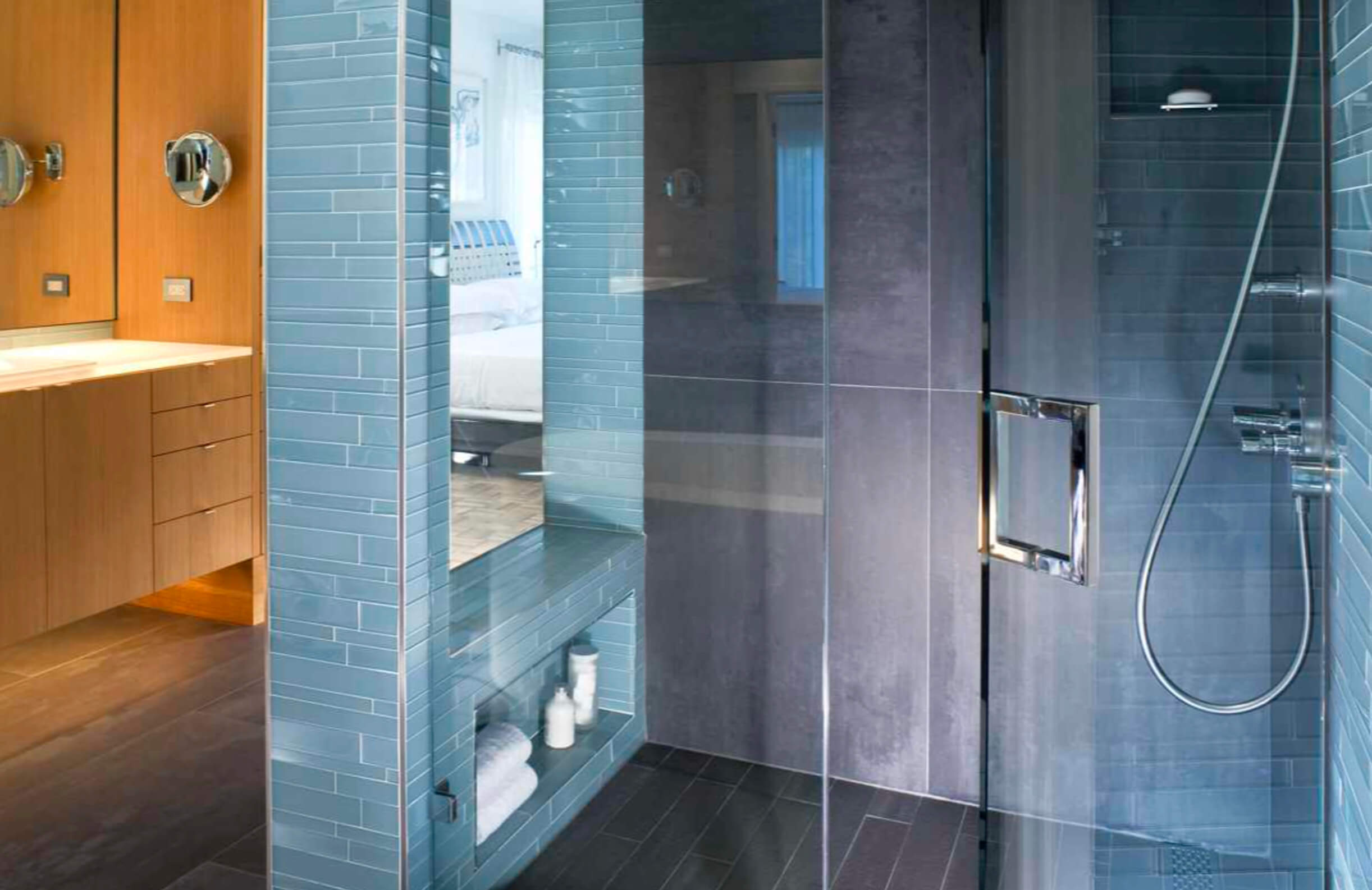 blue tile shower area with glass door