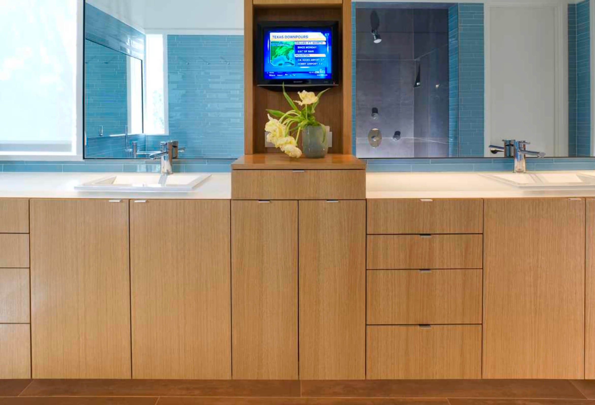 Matching pair of sinks and wood cabinets in bathroom